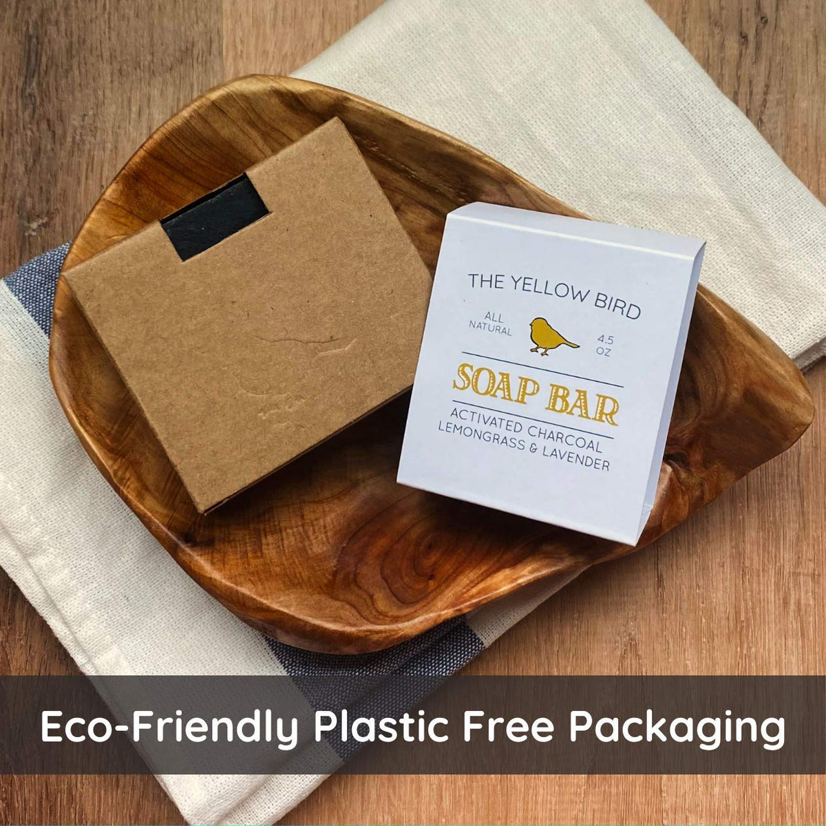 The Yellow Bird soap close-up texture highlighting activated charcoal and creamy consistency
