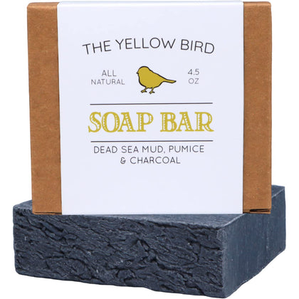 The Yellow Bird front packaging showing dead sea mud soap bar and benefits