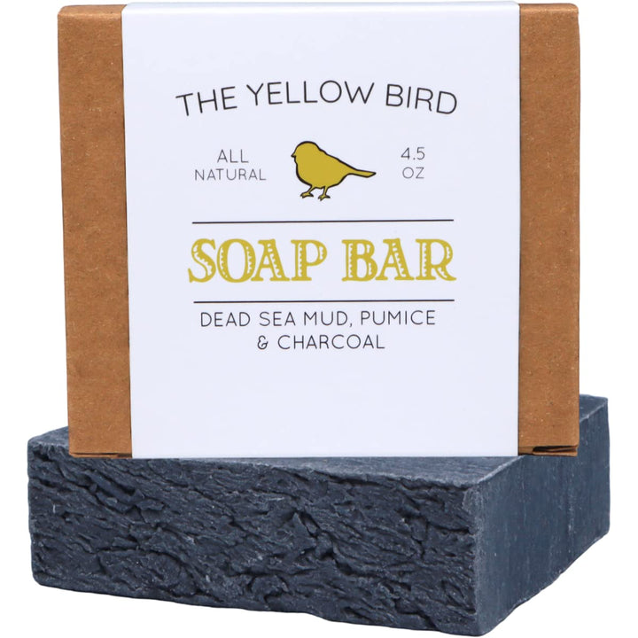 The Yellow Bird front packaging showing dead sea mud soap bar and benefits