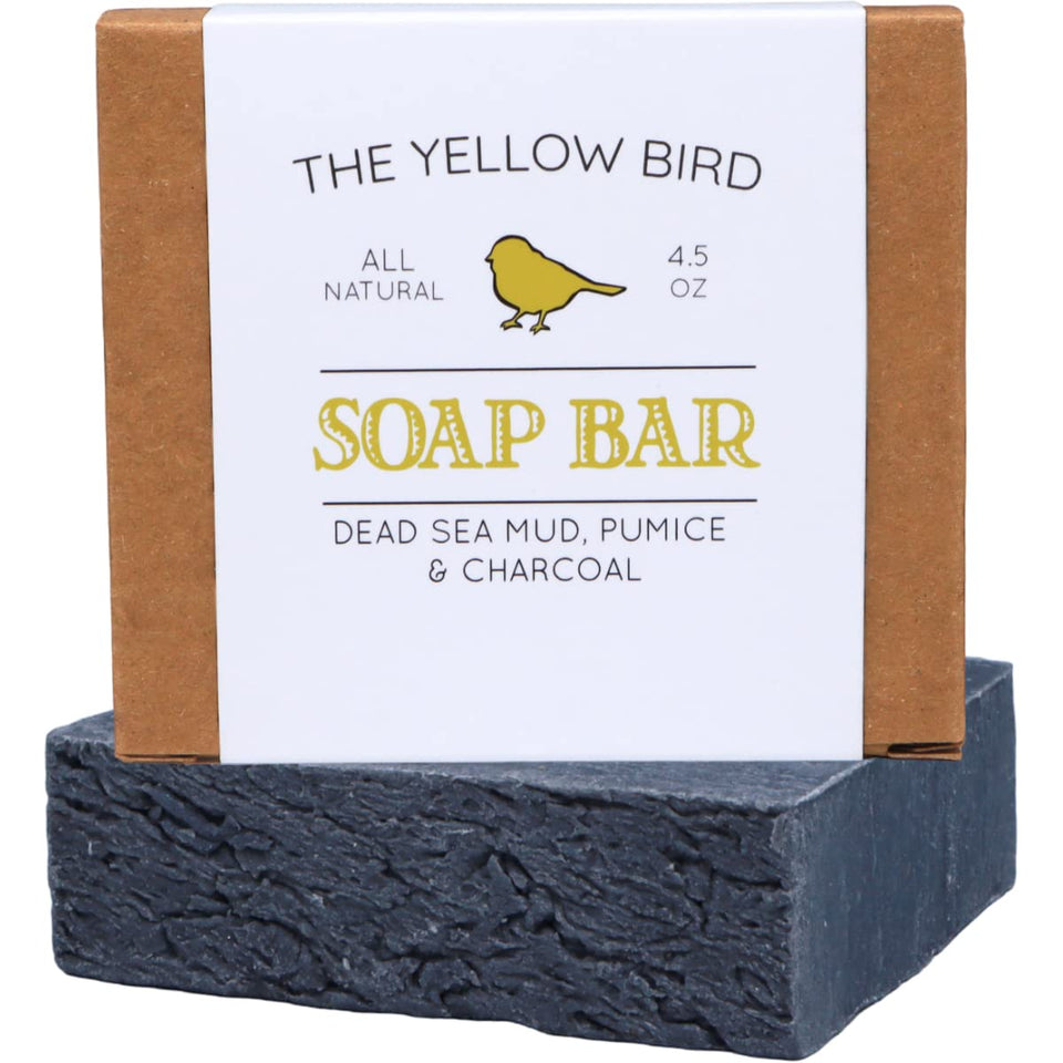 The Yellow Bird front packaging showing dead sea mud soap bar and benefits