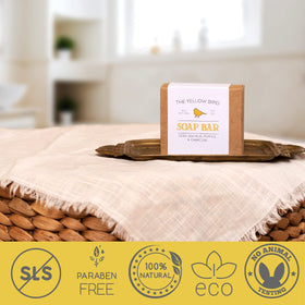 Applying The Yellow Bird soap to elbow to show exfoliating pumice effectiveness