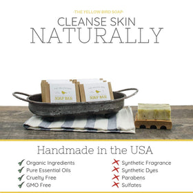 Bathroom shelf scene with The Yellow Bird soap adding natural decor and function