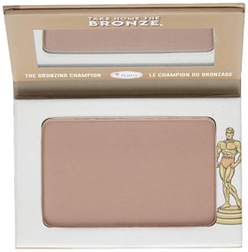 theBalm Oliver powder applied with brush on skin demonstrating blendability and sculpting benefit