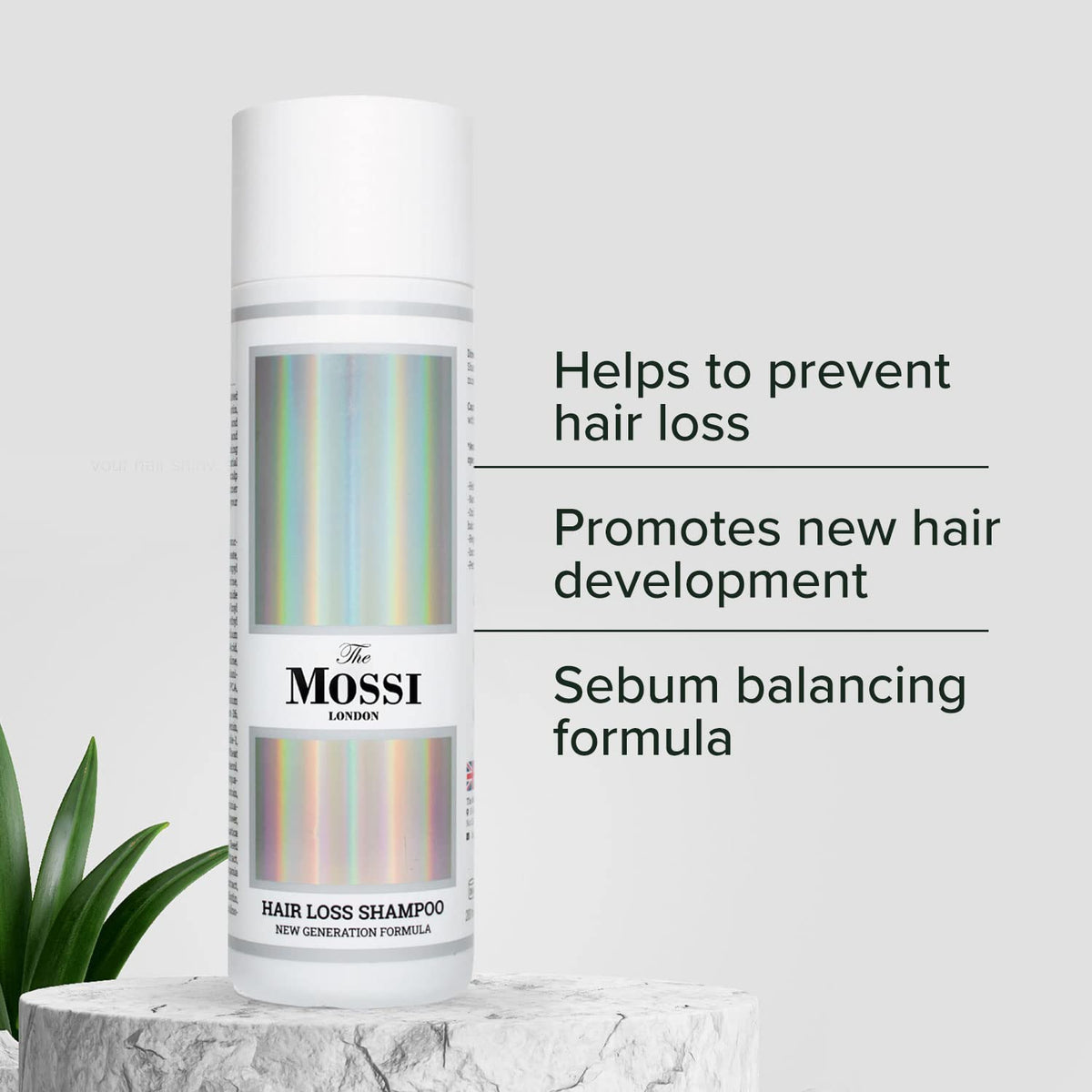 The Mossi London bottle in a hand to show the 200ml size and travel-friendly scale