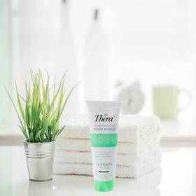 Thera caregiver applying cream to elderly skin showing gentle protective care