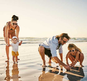 Thinksport family outdoors using sunscreen for sun protection during activities