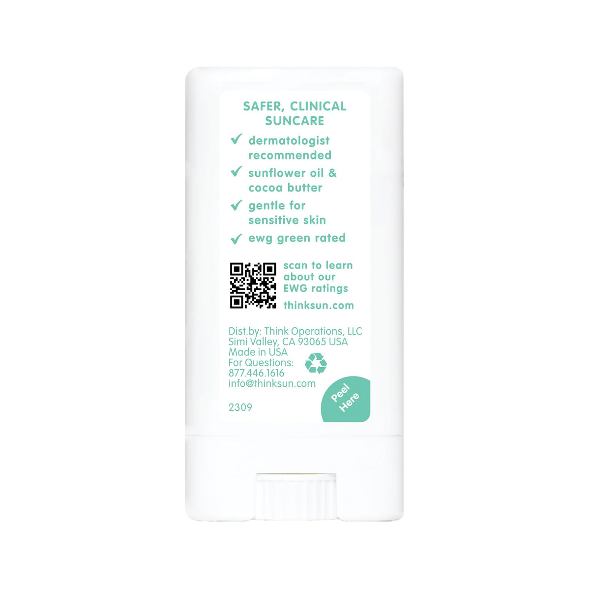 Thinksport stick on beach towel near toys—reef-safe sunscreen for seaside play