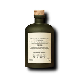 Third Layer body oil used in bedroom routine, implies relaxing evening ritual
