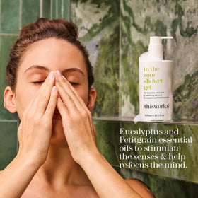 THISWORKS bottle placed on shower shelf suggesting refreshing daily use