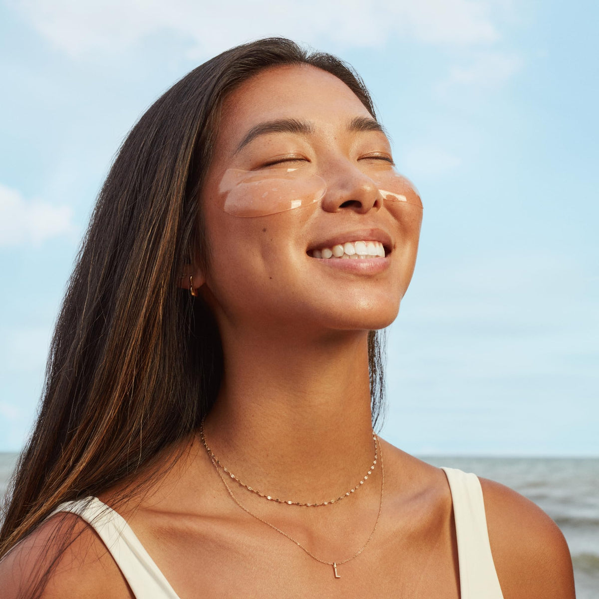 Three Ships patch applied under eye on model, demonstrates immediate coverage benefit