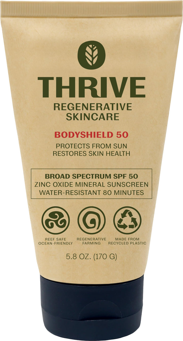 Thrive Natural Care front packaging showing SPF50 and reef safe benefit