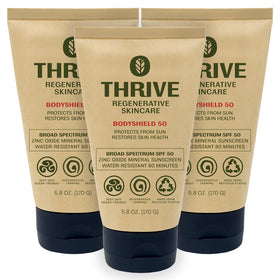 Thrive Natural Care front packaging showing SPF50 and reef-safe benefits