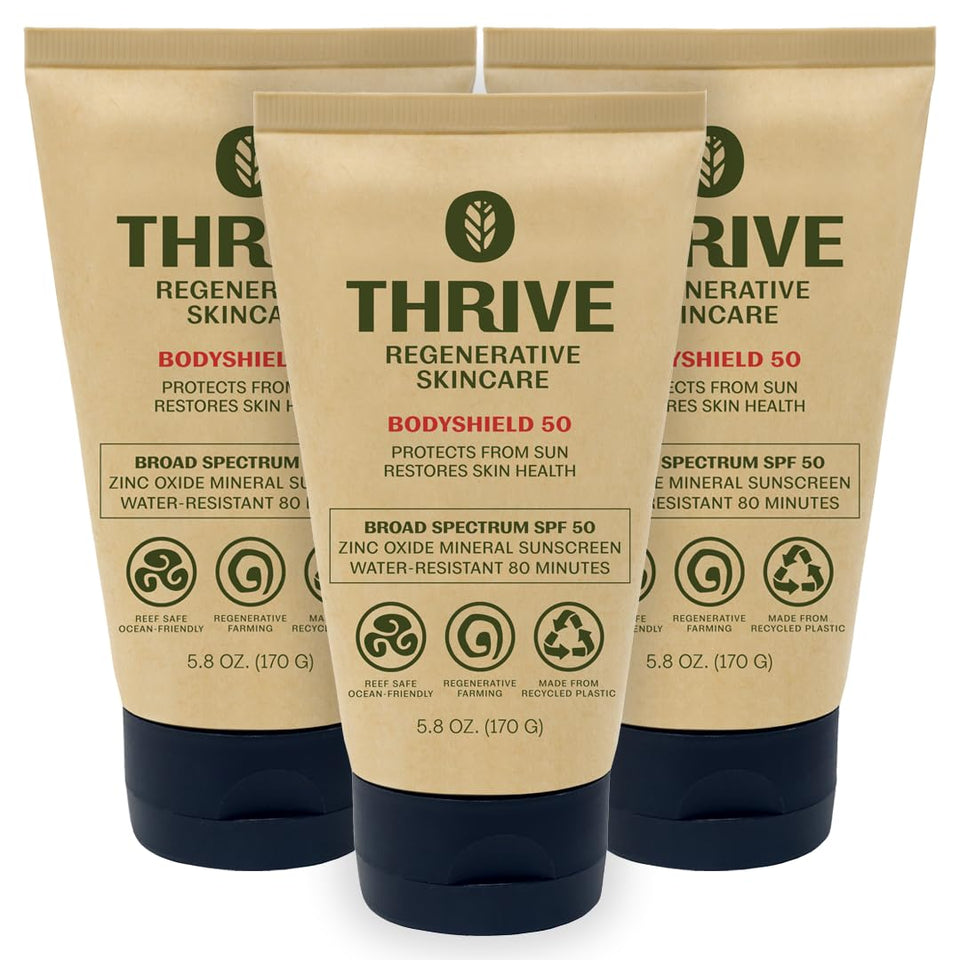 Thrive Natural Care front packaging showing SPF50 and reef-safe benefits