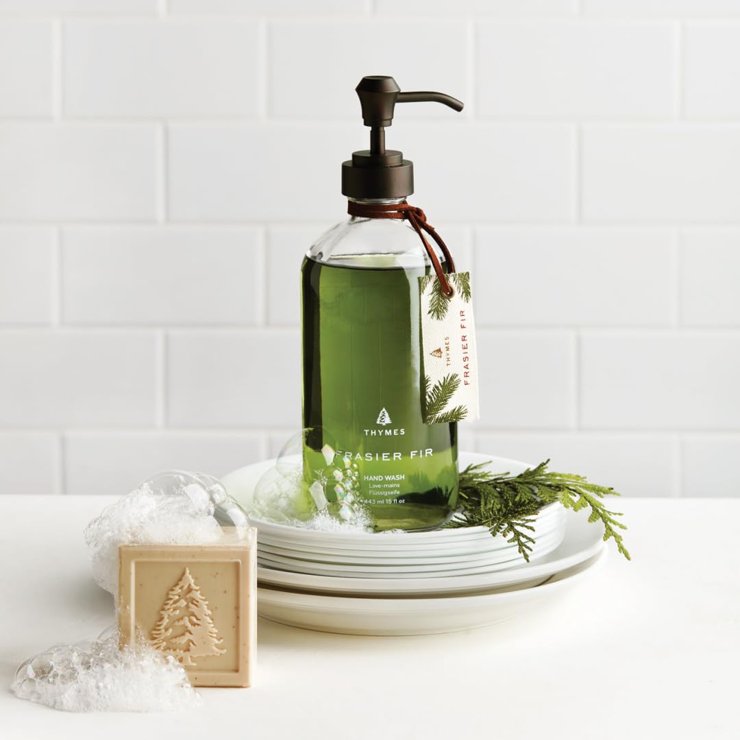 Thymes Frasier Fir bottle in bathroom setting adding decorative fragrance and ambiance