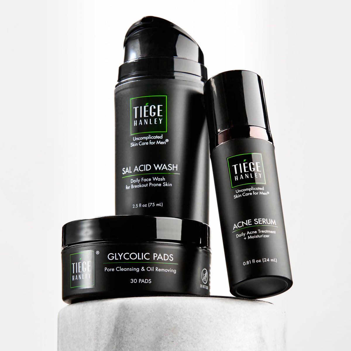 Tiege Hanley kit front packaging showing all three products and simplified routine benefits