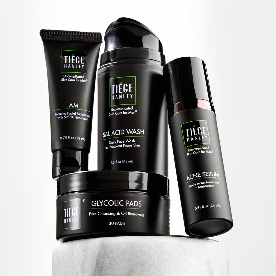 Tiege Hanley front packaging showing full four-piece acne kit and benefits
