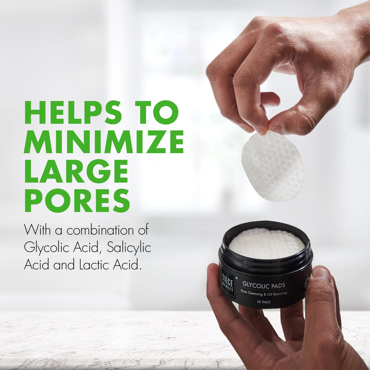 Tiege Hanley pad near face demonstrating pore-clearing and smoother skin
