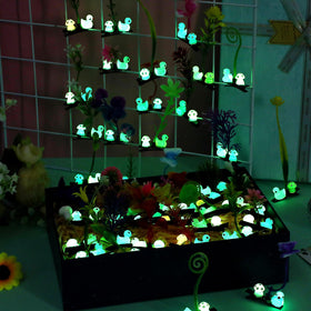 Tigeen glow-in-the-dark clips lit in low light for nighttime visibility