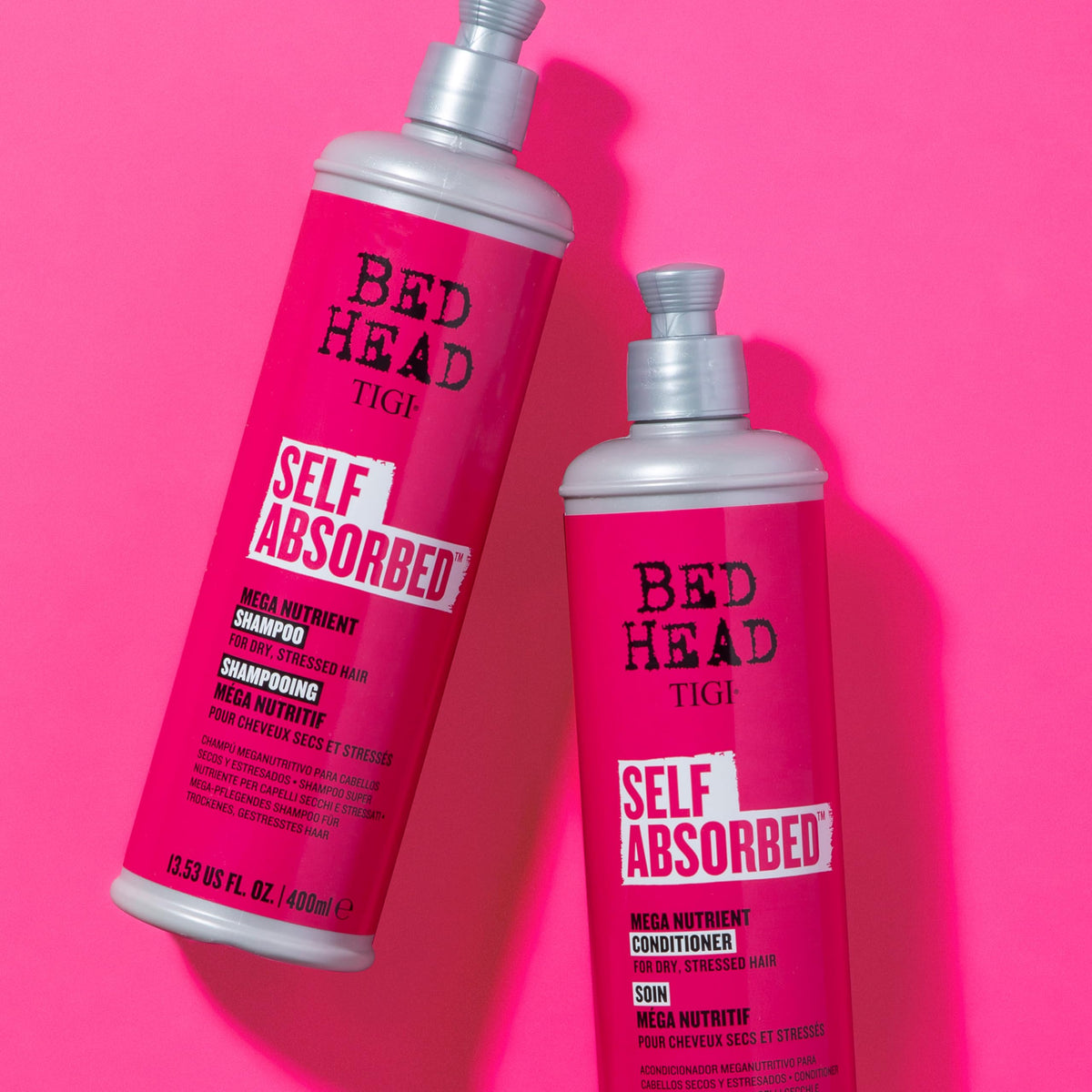 TIGI Bed Head size comparison next to hand showing 25.36 fl oz scale
