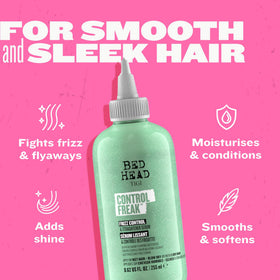 TIGI Control Freak 8.62 oz bottle beside a hand for size comparison and convenience