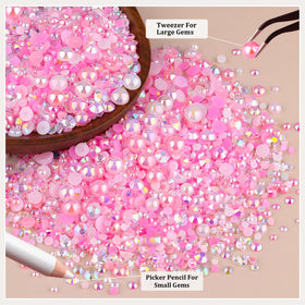 TINKRSTUFF decorated nails with pink rhinestones adding elegance