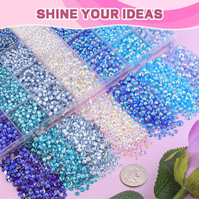 TINKRSTUFF hand holding different-sized gems showing scale and design versatility