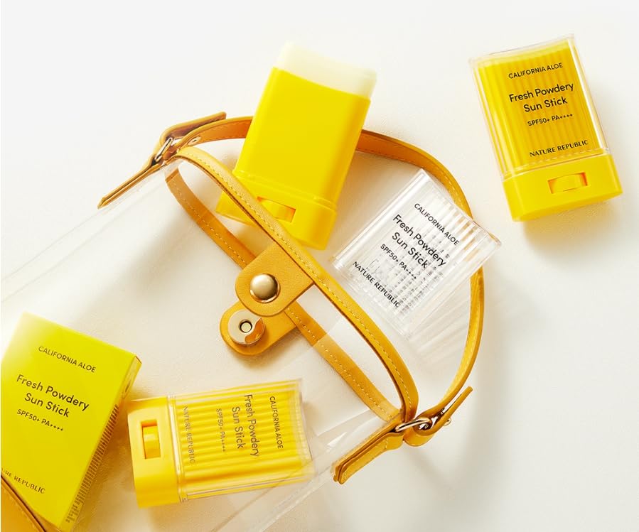 Tipiak model applying sun stick to face for easy on-the-go reapplication