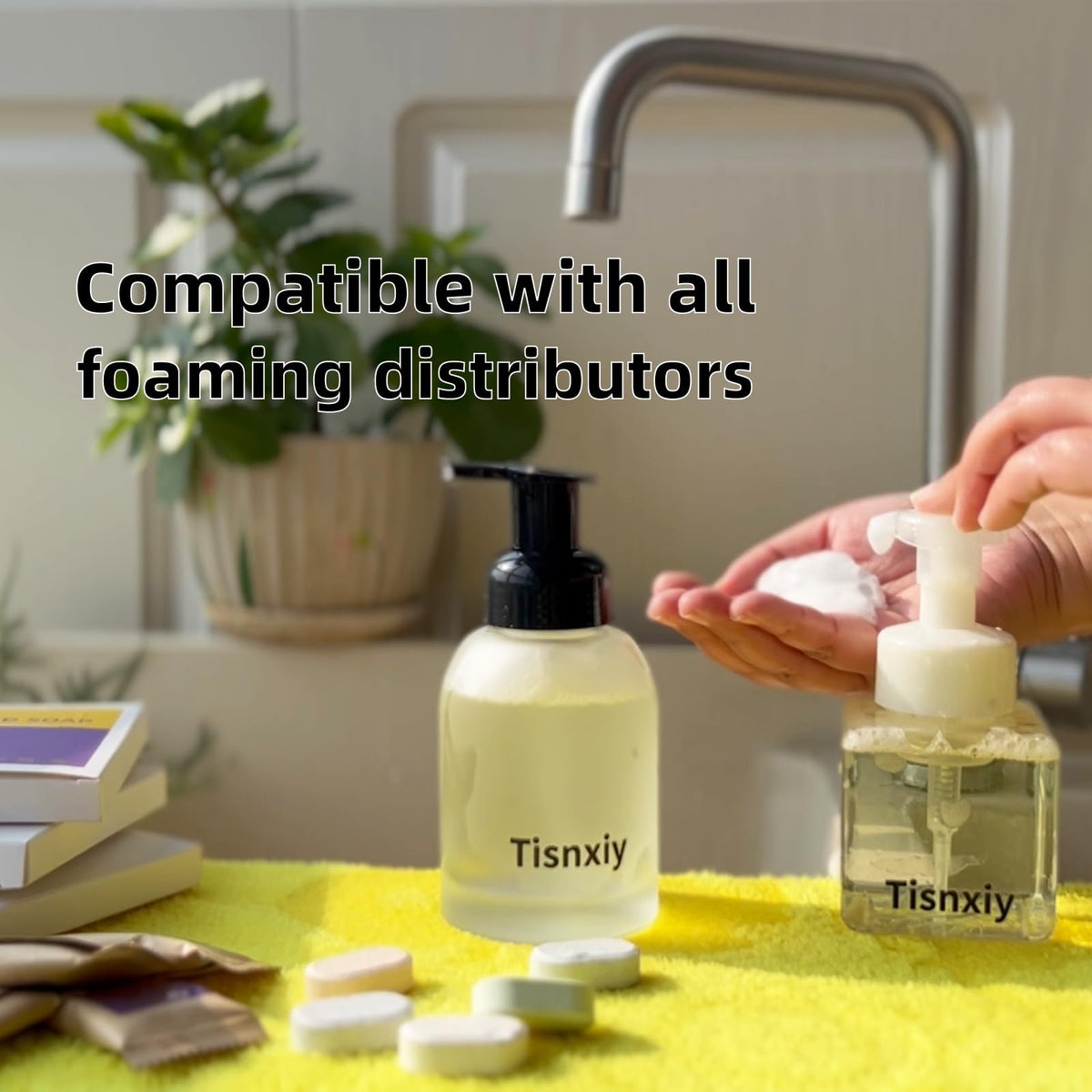 Tisnxiy tablet beside hand for scale showing portability and space-saving benefit