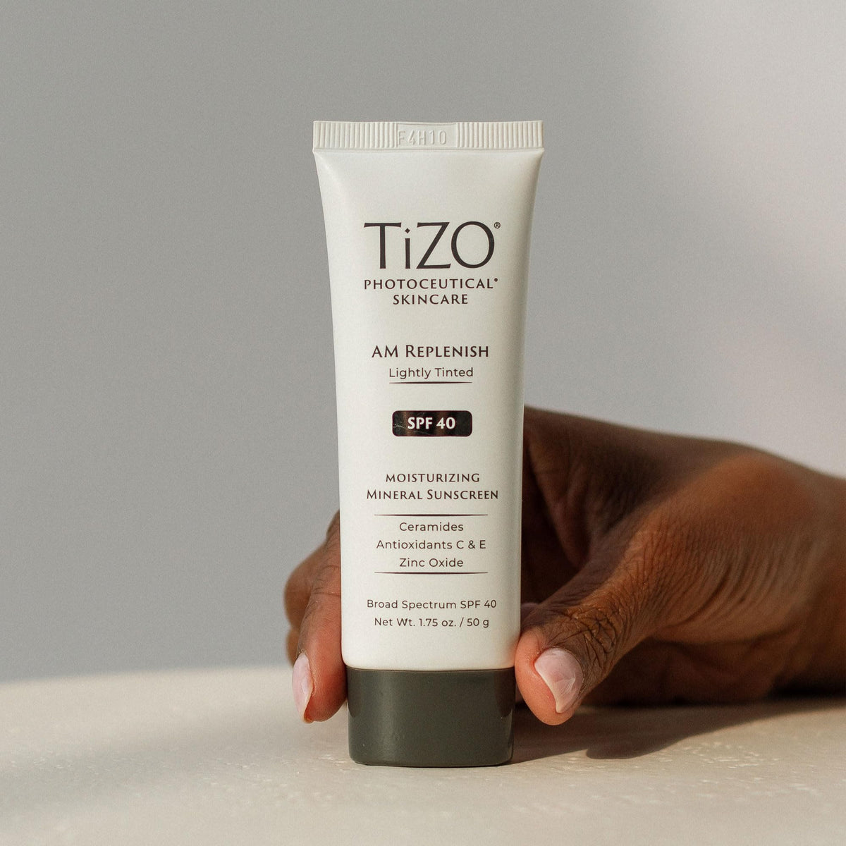 TIZO AM Replenish applied outdoors in sunlight showing everyday protective use