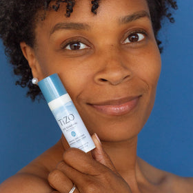 TIZO open jar showing cream consistency and antioxidant-rich formulation