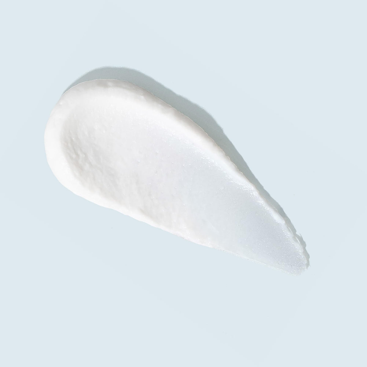 TIZO close-up texture revealing silky mineral primer and lightweight feel