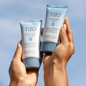 TIZO applying sunscreen on face illustrating calming post-procedure use