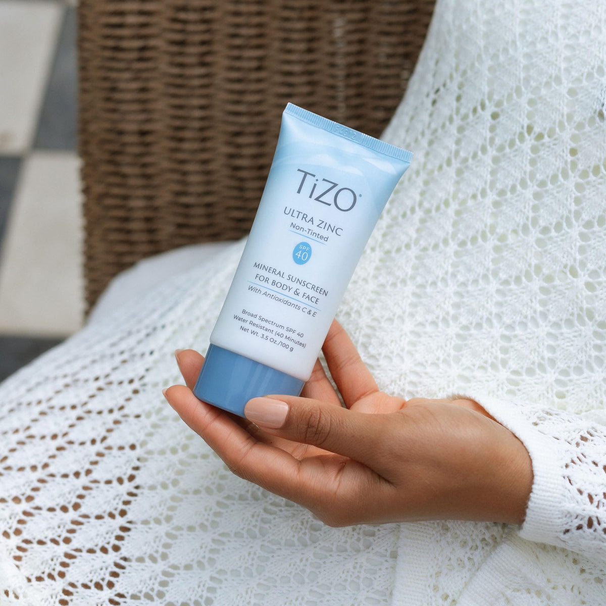 TIZO being applied to cheek showing even coverage and invisible blend