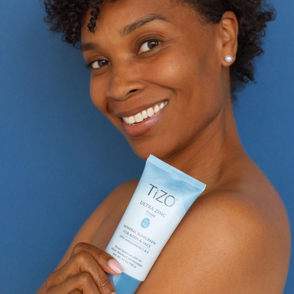 TIZO tinted swatch on skin demonstrating sheer, even coverage