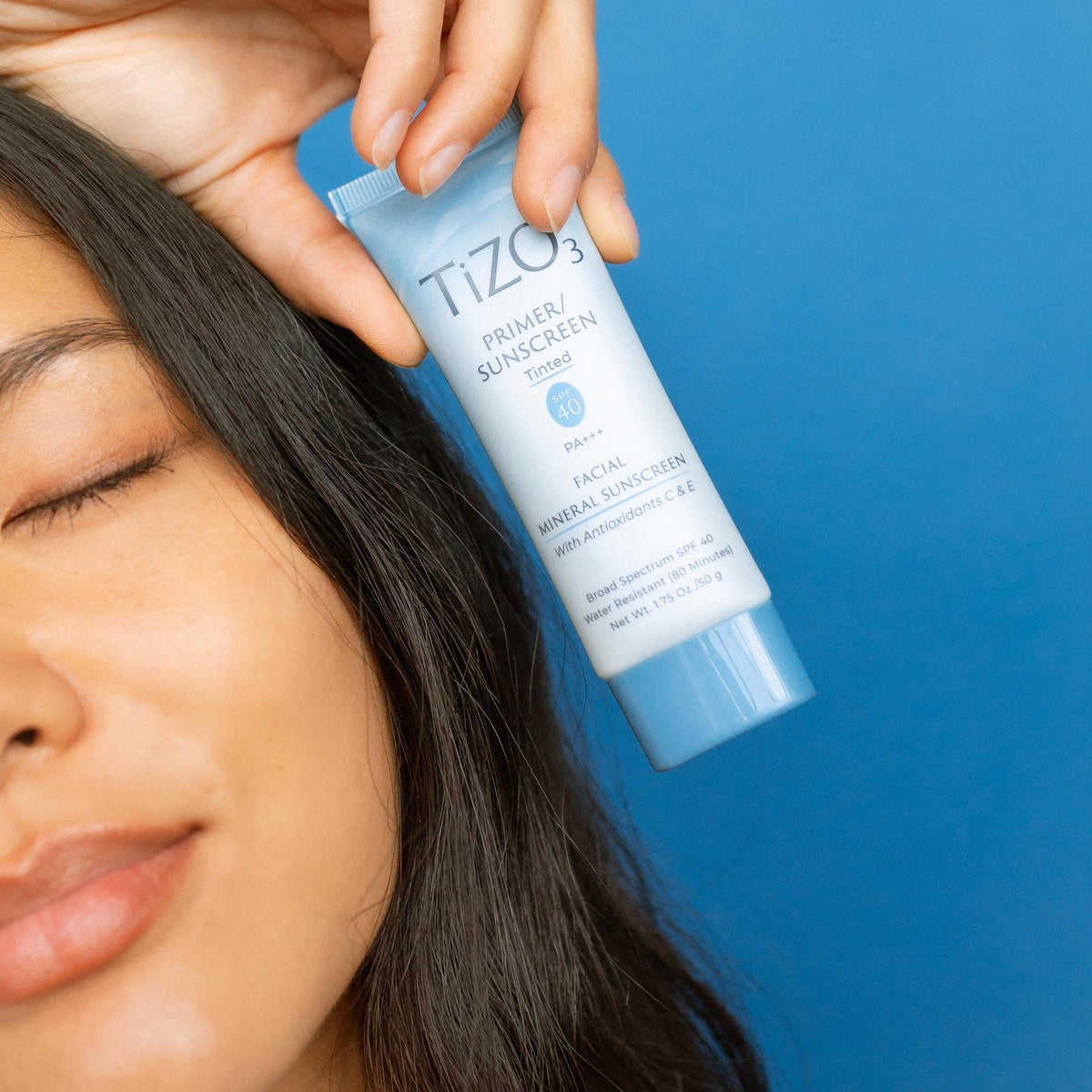 TIZO TiZO3 being applied on face providing lightweight coverage