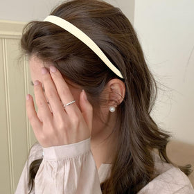TOBATOBA headband next to ruler showing slim profile and travel-friendly size
