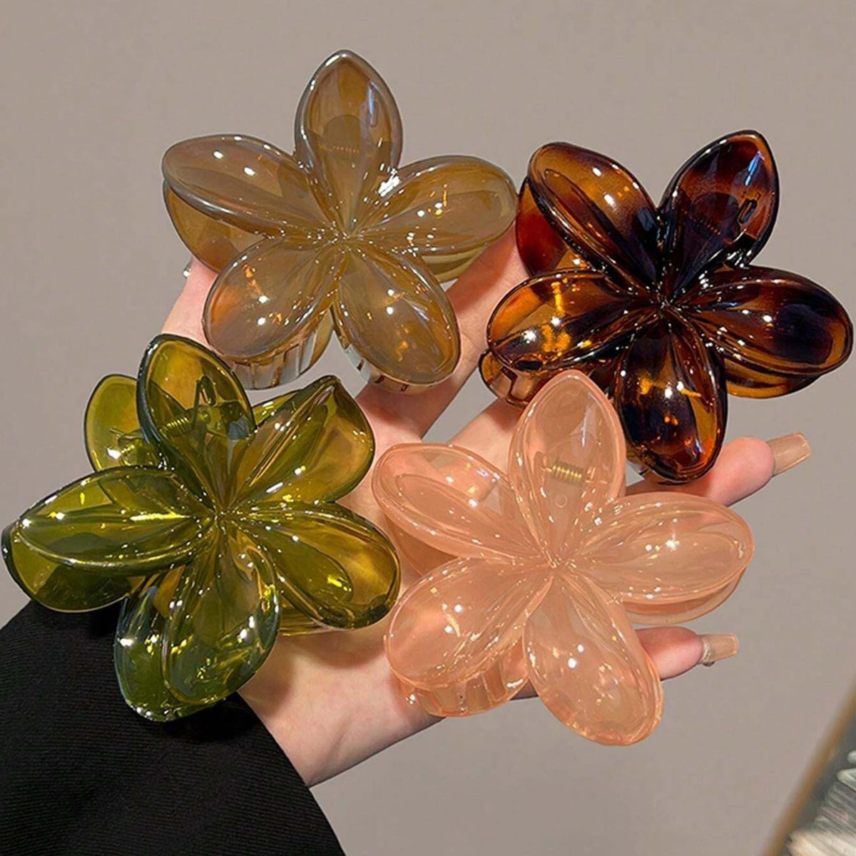 Tobeffect front view of four flower clips showing pastel neutral palette and elegant finish