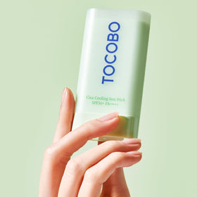 TOCOBO applying stick to cheek demonstrating quick, mess-free protection benefit