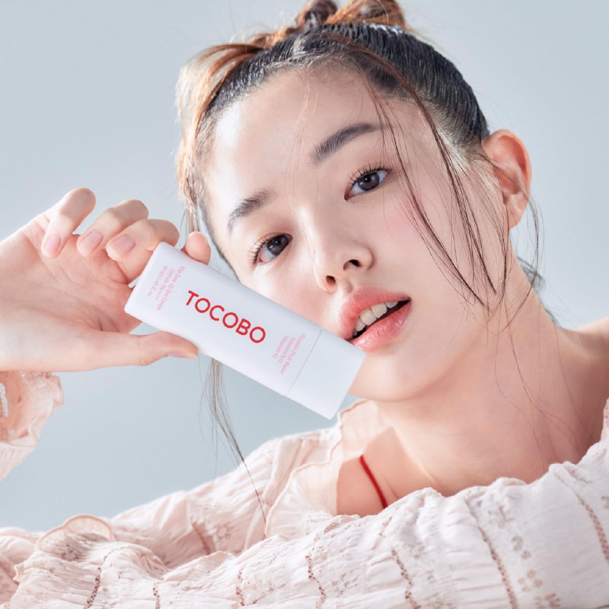 TOCOBO applied to face demonstrating subtle pink tone-up effect