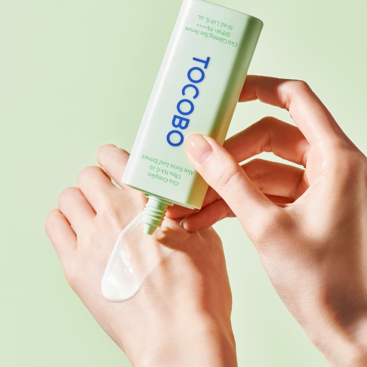 TOCOBO bottle beside common items showing compact size and portability