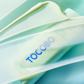 TOCOBO droplet applied to skin demonstrating soothing, hydrating effect
