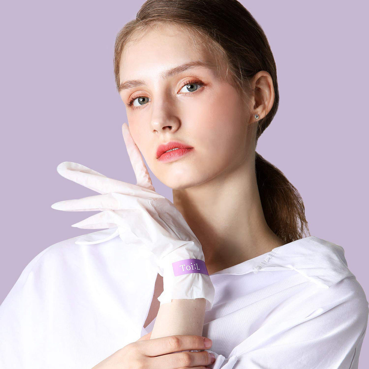 TOI:L close-up of silky serum texture on glove interior highlighting hydration