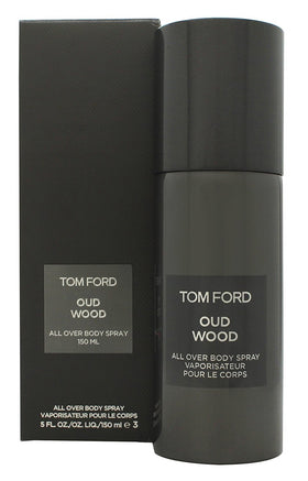 Tom Ford Oud Wood bottle beside lotion showing travel-friendly size and layering
