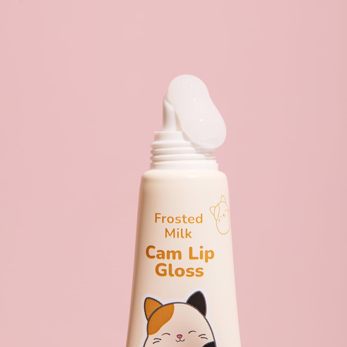 TONYMOLY Cam lip gloss open on finger showing glossy finish and shine