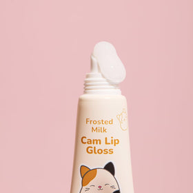 TONYMOLY Cam lip gloss open on finger showing glossy finish and shine