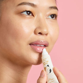 TONYMOLY Cam set held in hand demonstrating compact travel-friendly size