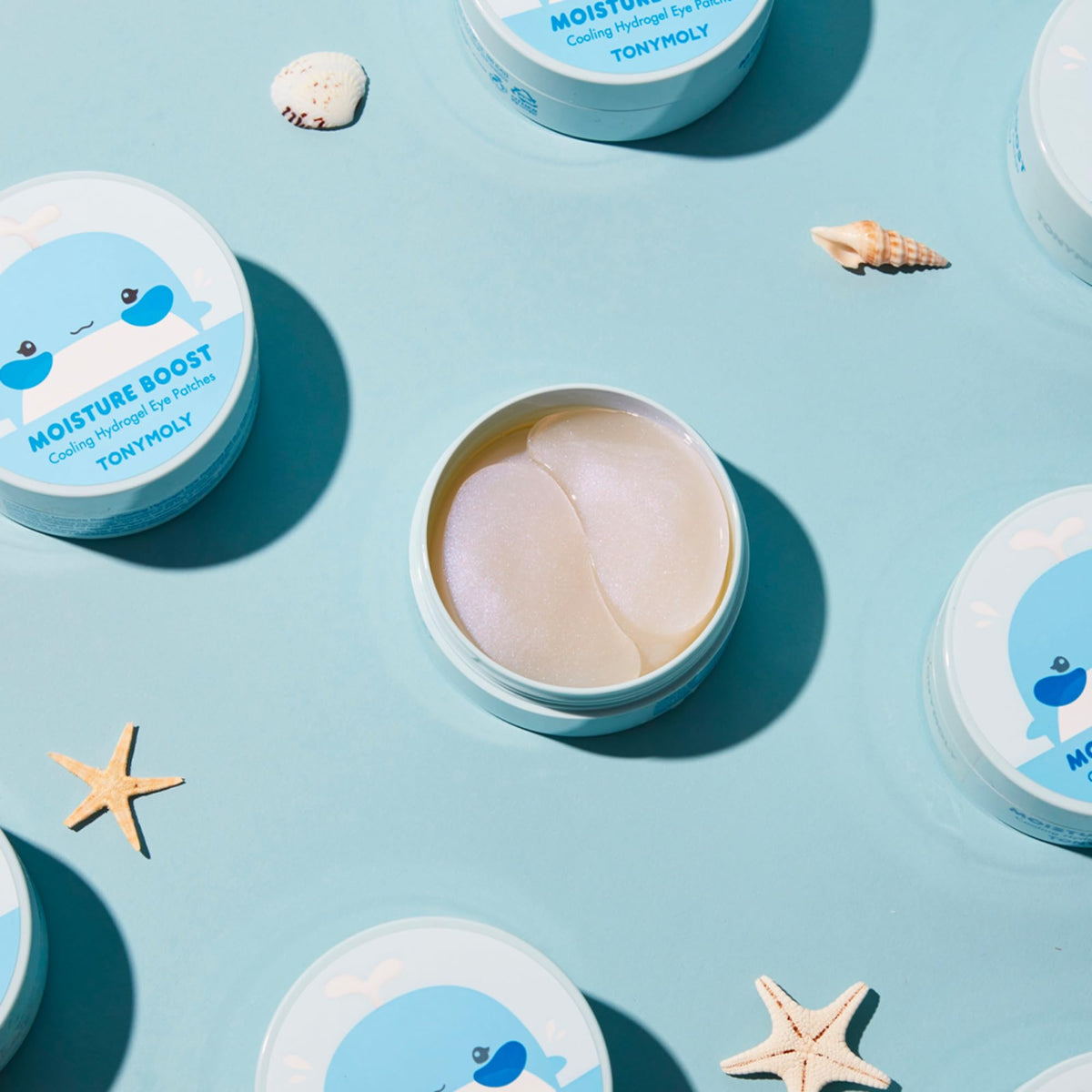 TONYMOLY patches on bathroom vanity with towel, promotes daily self-care benefit