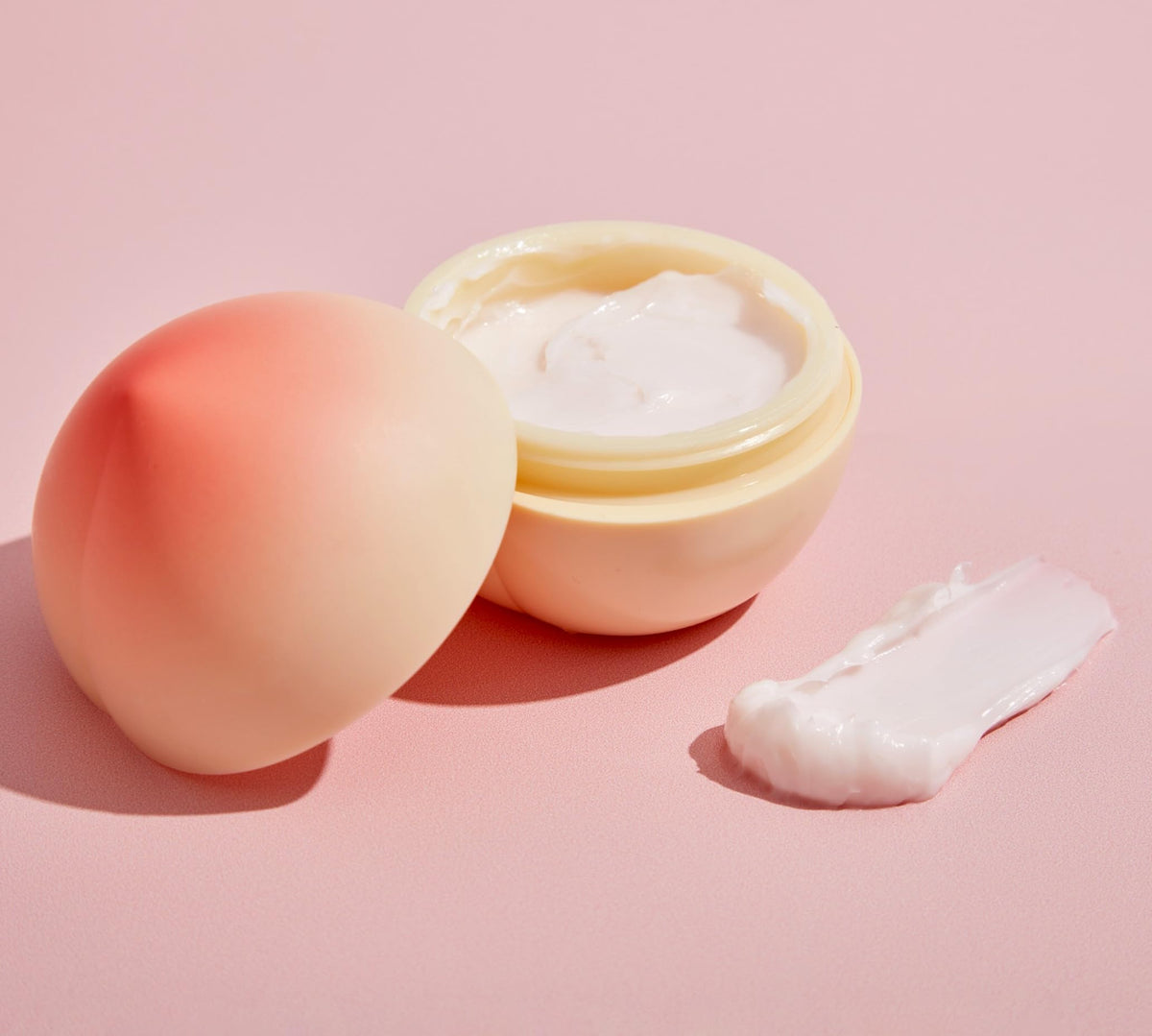 TONYMOLY peach hand cream on vanity with soft lighting showcasing decorative packaging and daily use