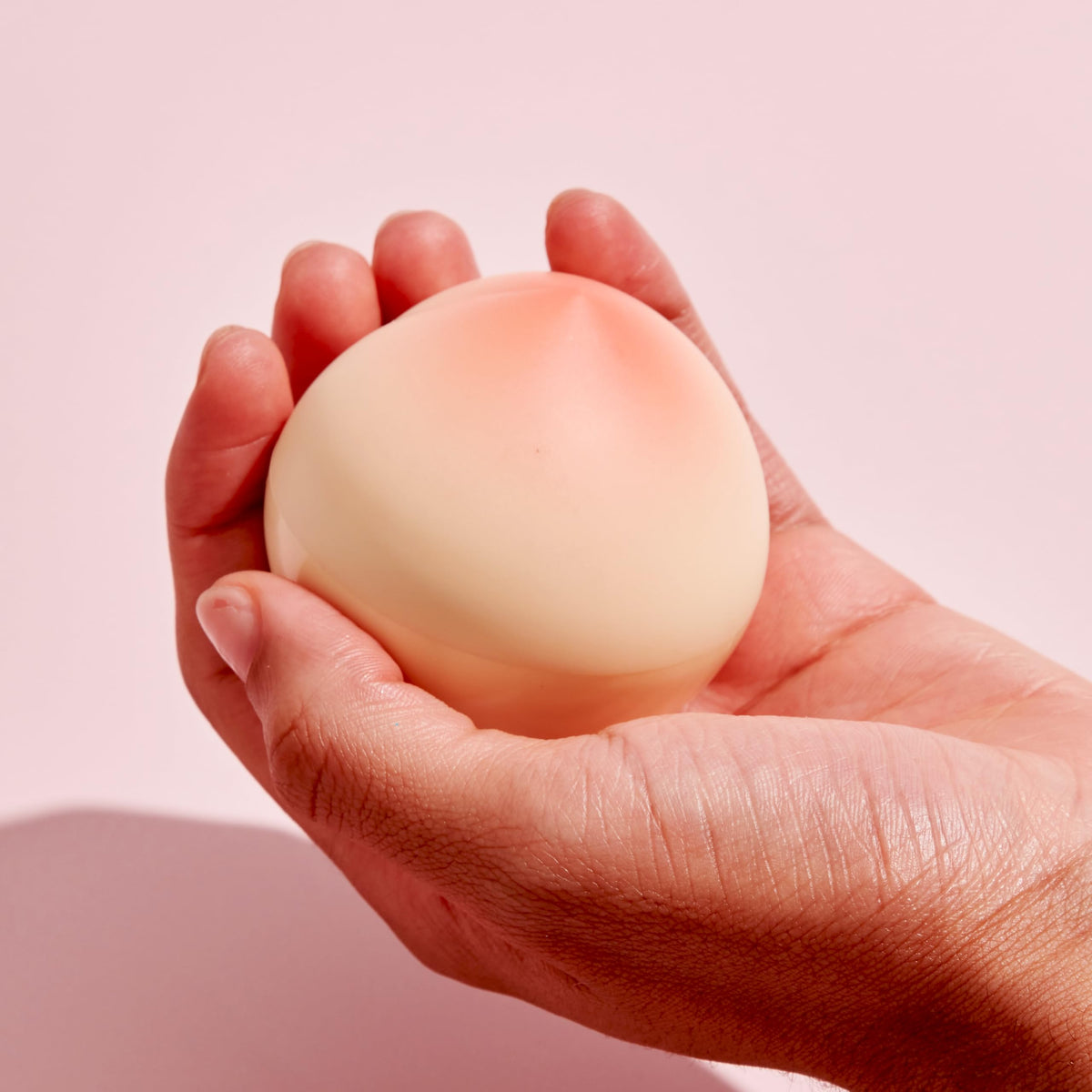 TONYMOLY cream texture close-up on fingertip showing smooth, fast-absorbing formula benefit