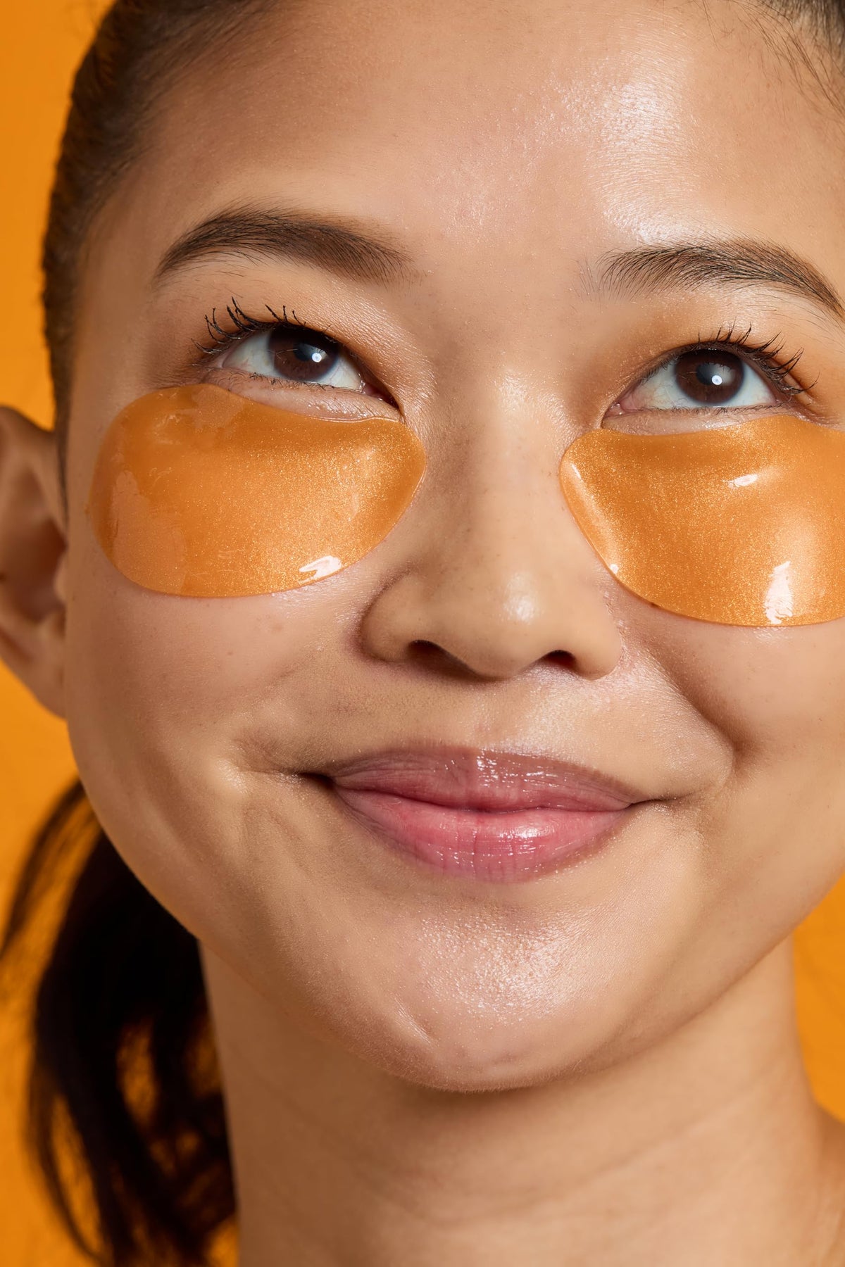 TONYMOLY eye patches applied under eye demonstrating immediate refreshing effect